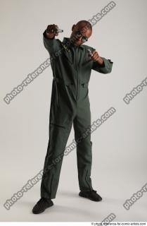 ERIC STANDING POSE WITH GUNS